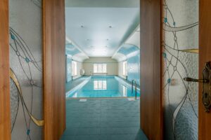 Indoor Pool with Glass Walls: Luxury Design, Light & Year-Round Comfort