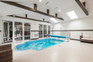 Indoor Pool with Glass Walls: Luxury Design, Light & Year-Round Comfort